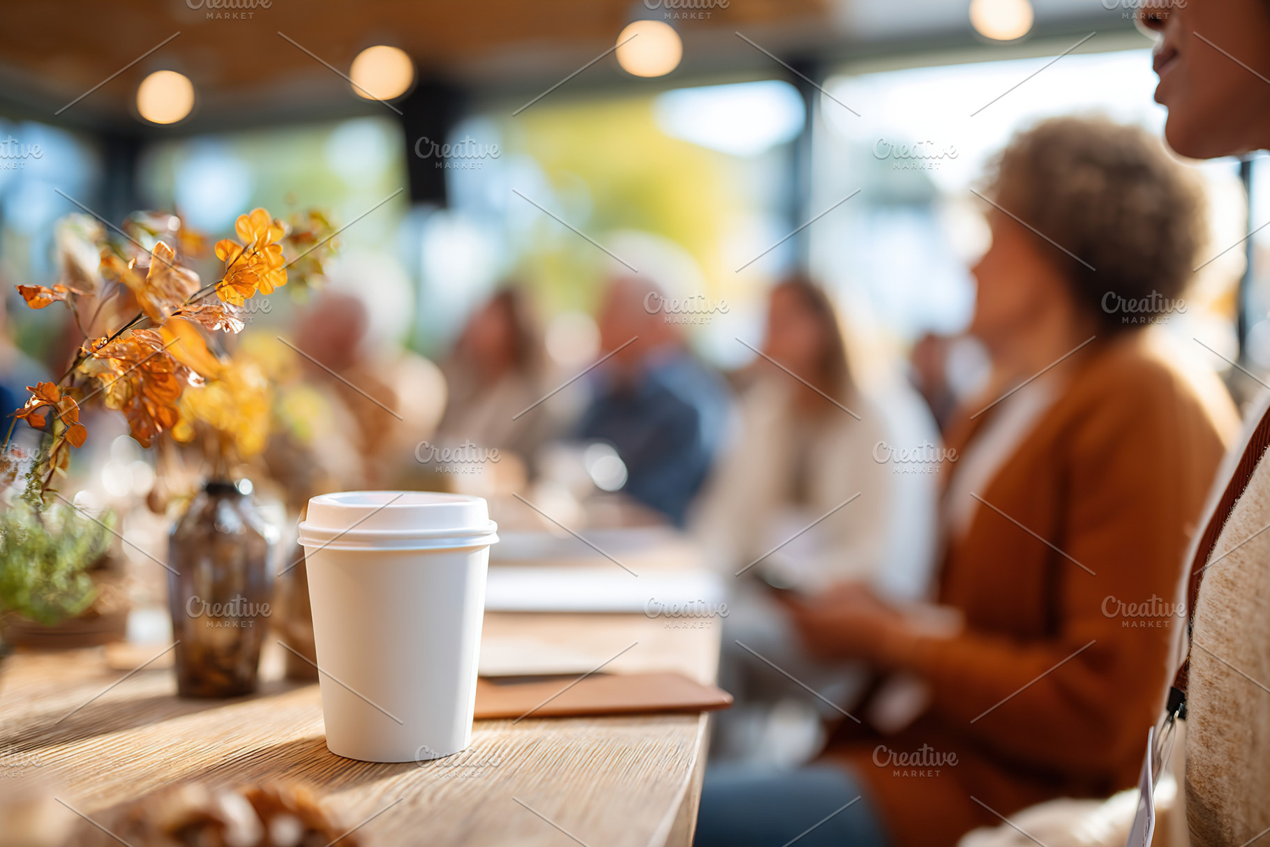 People engage in a group discussion during a workshop with coffee and decor pre, a Photo by AlyaAnd