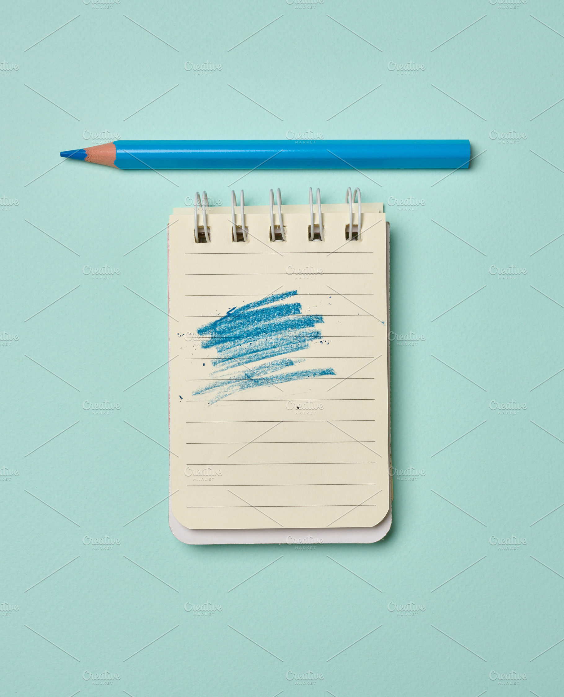 Spiral-bound lined notepad with a blue scribbled stroke and a bl, a School & Education Photo by ndanko