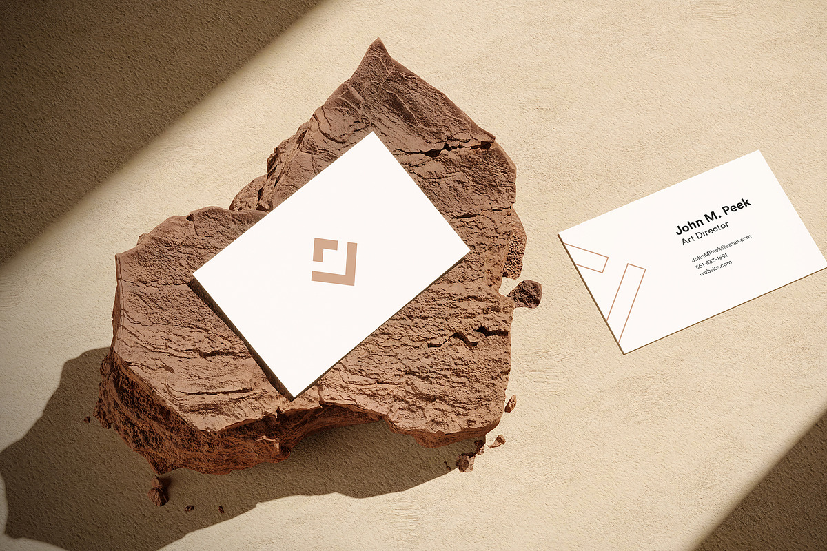 Business Card Mockup on Rock, a Cups & Container Mockup by imonedesign