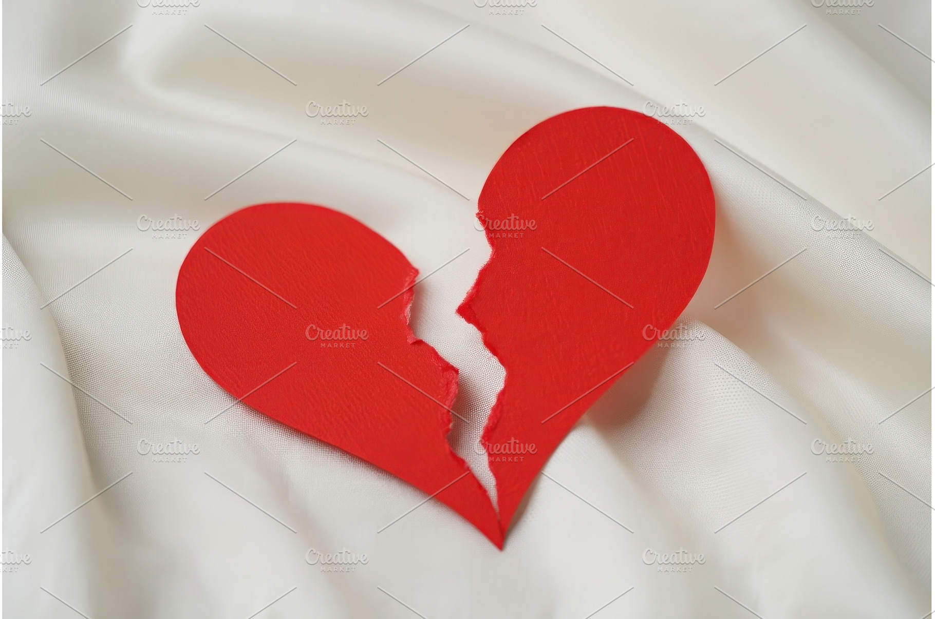 Broken red heart on white textile, an Abstract Photo by Voodz_shop