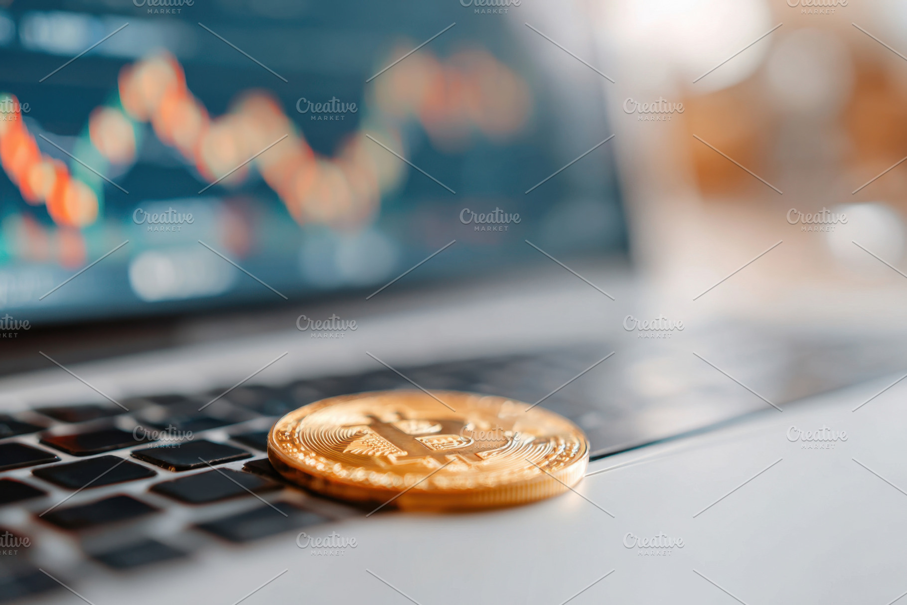 Gold bitcoin on laptop keyboard with cryptocurrency charts, a Business Photo by AlyaAnd