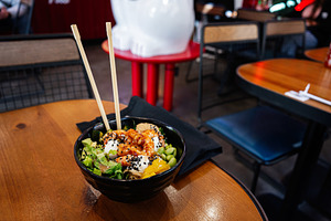Delicious poke bowl with shrimp served at a modern dining restaurant, a Photo by AS photostudio
