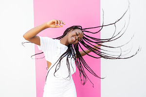 Young happy girl with braided hair, a Person Photo by Artem Varnitsin