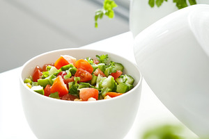 Fresh vegetable salad in a white bow, a Photo by Dvoevnore photos