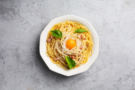 Italian pasta carbonara on a concret stock photo containing carbonara and, a Food & Drink Photo by zakiroff