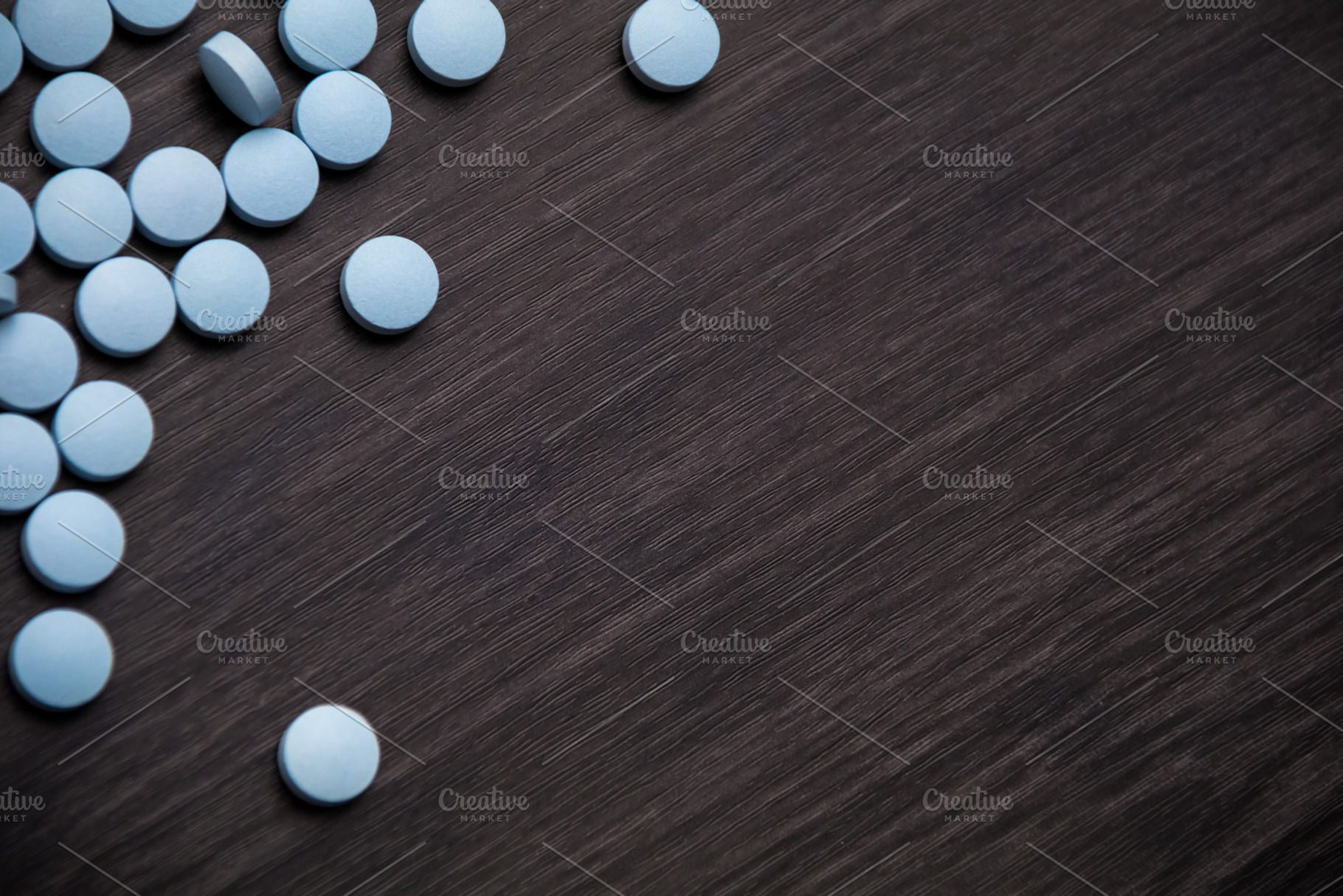 Medication blue pills with copy spac, a Background Photo by Daniel Megias