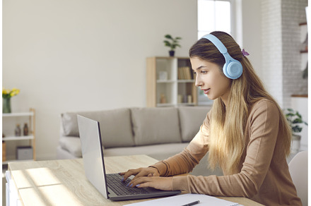 Girl in headphones study online on, a School & Education Photo by StudioRomantic