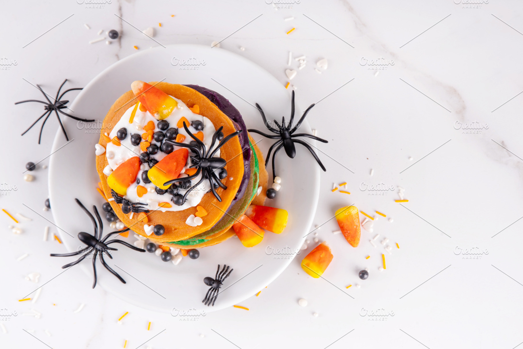 Colorful Halloween Pancakes with candy, pumpkin spider decoratio, a Food & Drink Photo by Rimma