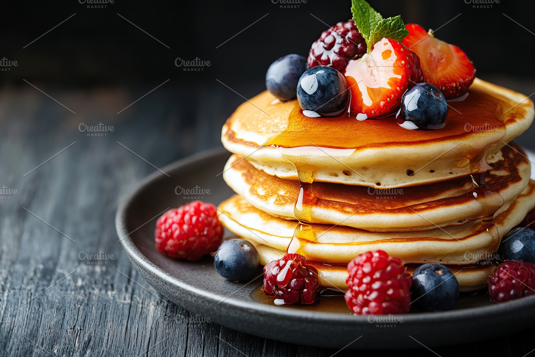 Fluffy pancakes stacked high, topped with fresh berries and drizzled with sweet, a Food & Drink Photo by AlyaAnd