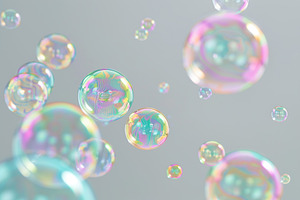 Rainbow soap bubbles on grey background, a Photo by AlyaAnd
