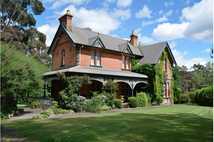 Large victorian house standing on a, an Architecture Photo by Ylivdesign