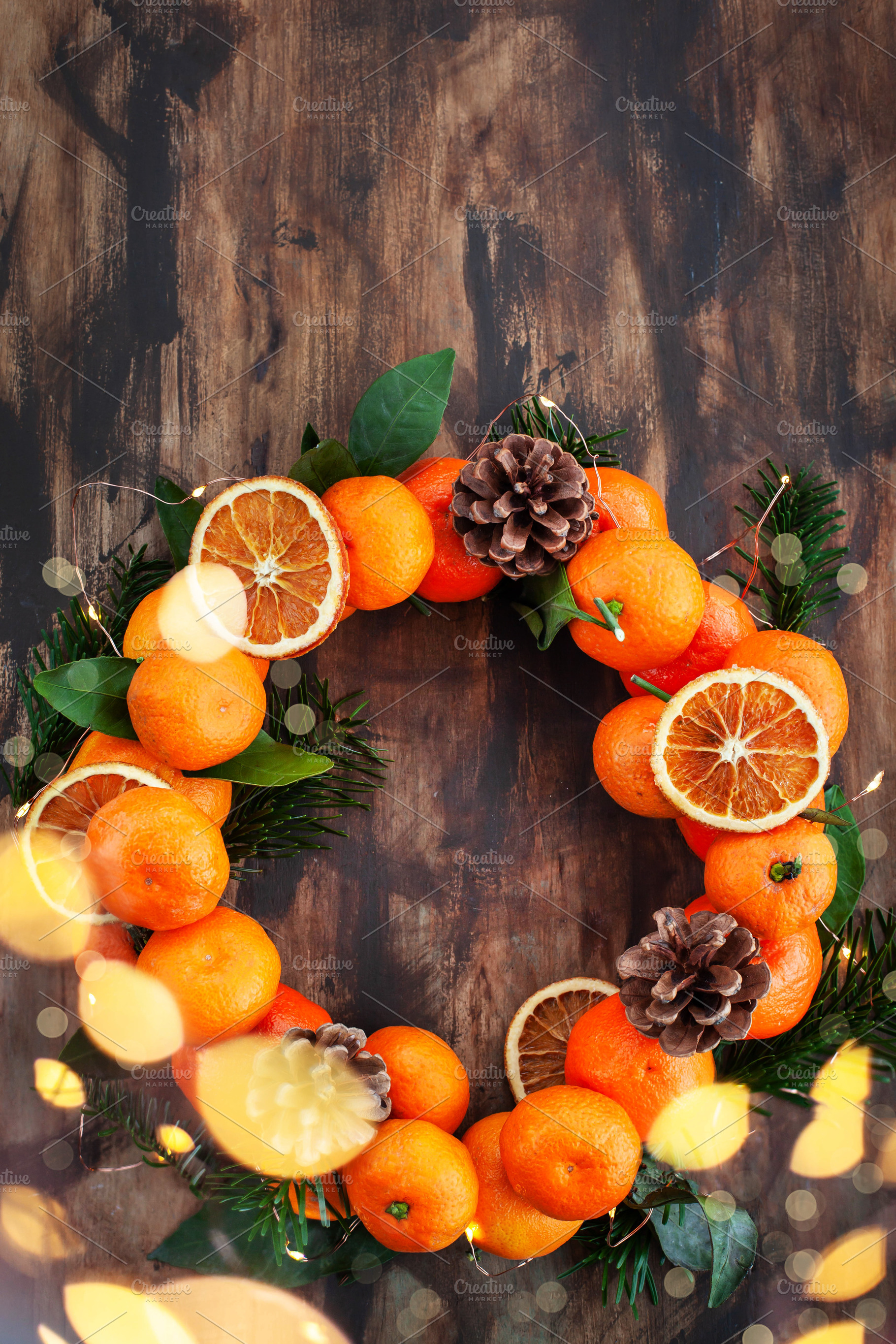 Wreath of fresh ripe tangerines with, a Holiday Photo by Kate S