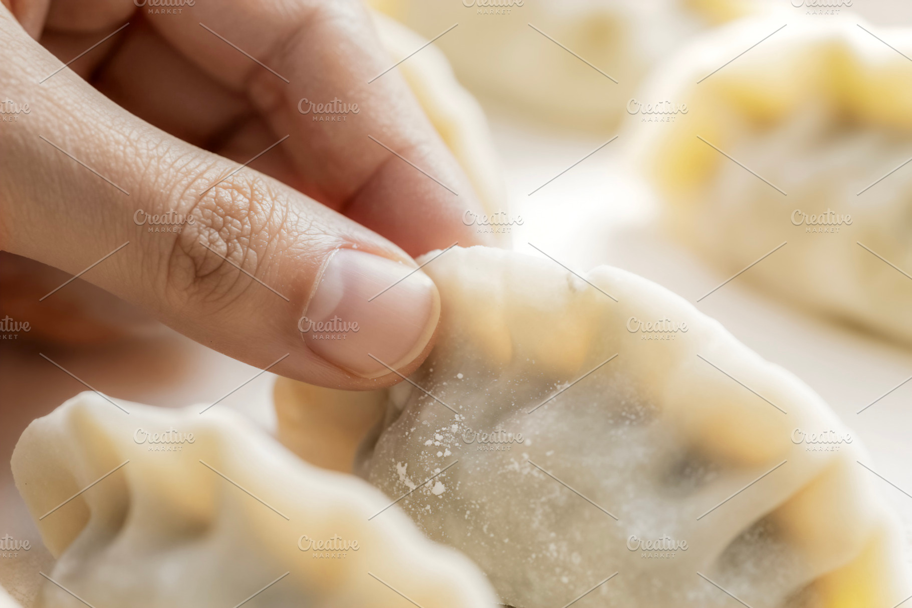 Hand Pleating a Raw Dumpling, a Photo by rarrarorro
