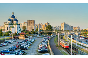 Cathedral of the Holy Trinity and a light rail tram in Troieshchyna -, an Architecture Photo by Leonid Andronov