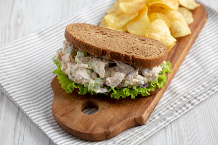 Homemade Chicken Salad Sandwich with Potato Chips, side view., a Food & Drink Photo by LiudmylaChuhunova