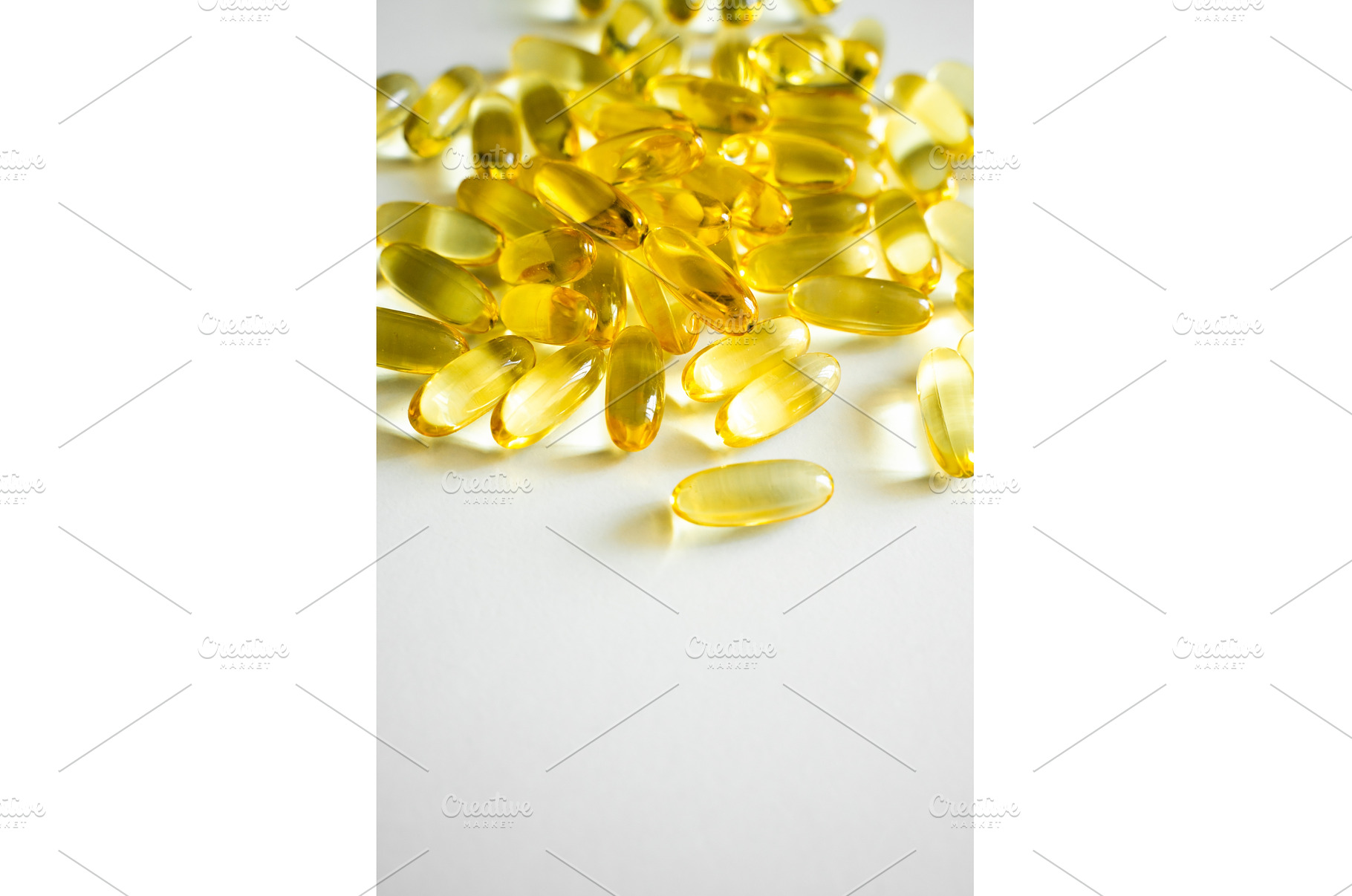 Golden yellow softgel capsules, a Health & Medical Photo by volodymyrshtun13795