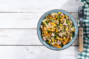 Pasta salad with tuna, corn and olives in bowl, a Food & Drink Photo by etorres69