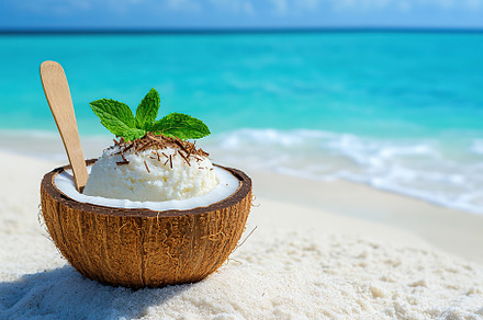 Coconut shell filled with creamy coconut ice by the tranquil beach under a clea, a Food & Drink Photo by AlyaAnd