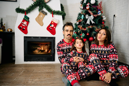 Family wearing matching Christmas pajamas, a Holiday Photo by YossSabalet
