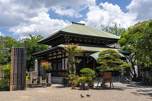 Main building of Isshin-ji Temple surrounded by garden in Osaka,, an Architecture Photo by GoodGoods