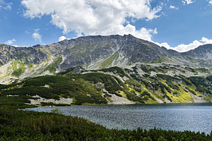 Scenic mountain lake near Zakopane Poland with rocky peaks and green slopes und, a Nature Photo by AS photostudio