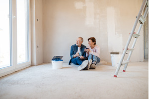 Senior couple resting while painting, a Person Photo by HalfPoint