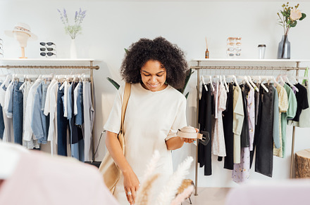 Stylish woman in boutique choosing, a Beauty & Fashion Photo by Artem Varnitsin
