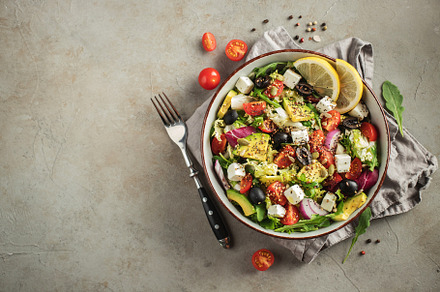 Delicious and healthy green salad of different leaves and vegetables with seeds, a Food & Drink Photo by Budarinphoto
