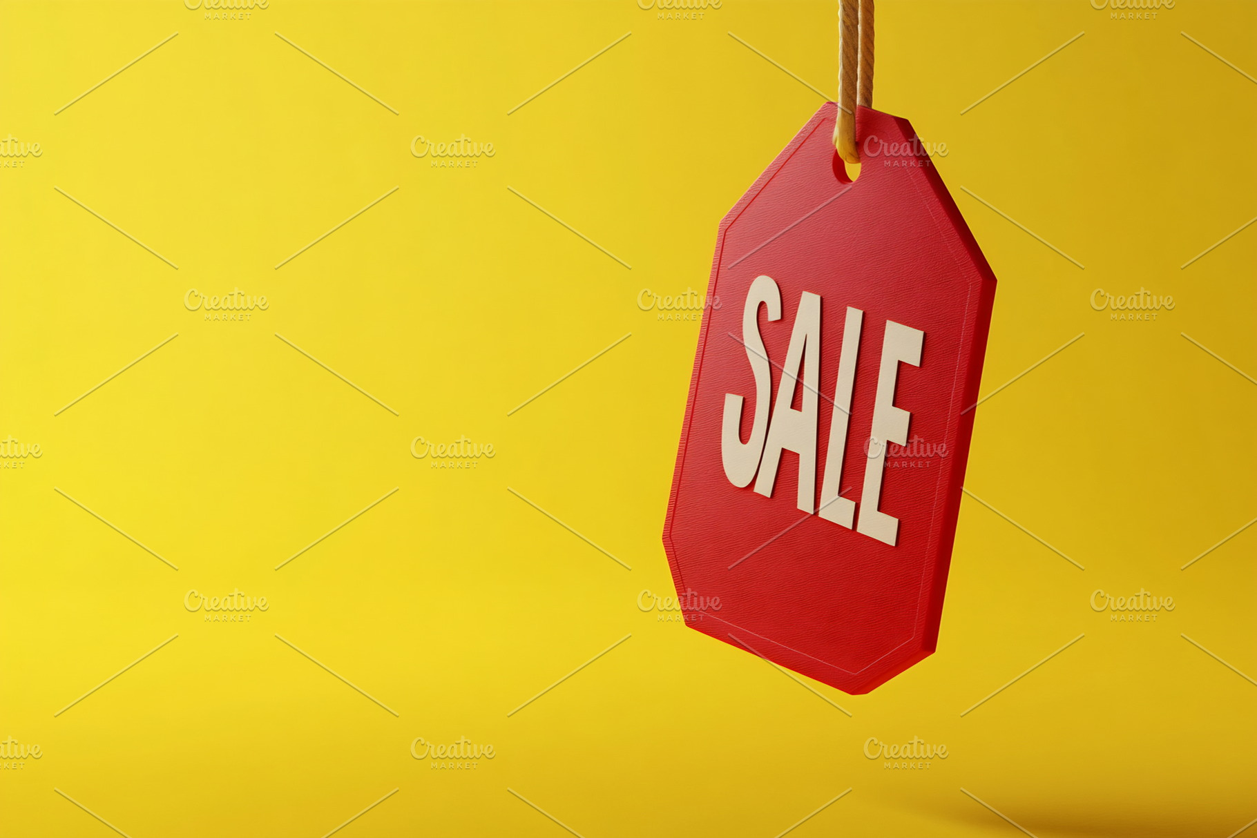 Red tag on yellow bg, a Photo by Beautiful things