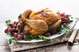 Roast turkey with grapes and parsley on white plate, a Food & Drink Photo by etorres69