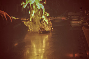 Flambe scallops on a grill, a Photo by Patricia Hofmeester