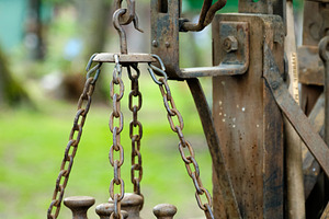 Close-up of an old, weathered weighing scale with its rusty chains and heavy me, an Industrial Photo by Rohan Photography