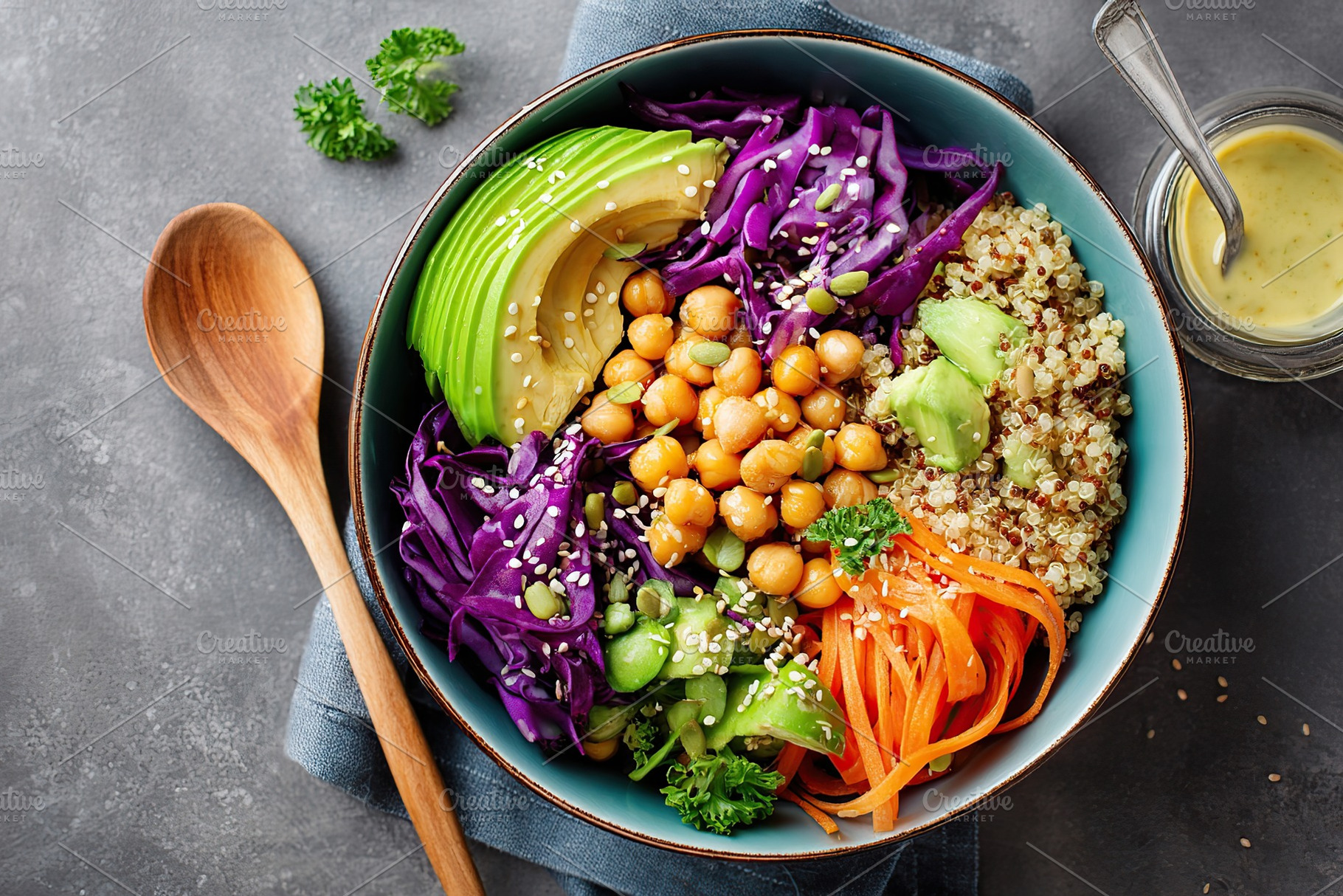 Delicious vegan bowl featuring quinoa, avocado, and purple cabbage with chickpe, a Food & Drink Photo by AlyaAnd