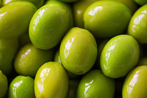 Fresh green olives background showing healthy Mediterranean diet, a Photo by Studio ANNA