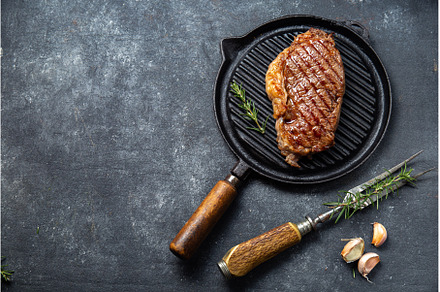Fried strip loin steak on vintage, a Food & Drink Photo by LARISA BLINOVA