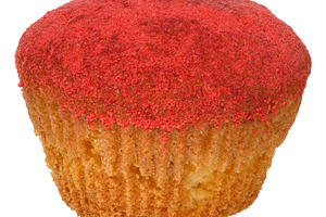A single red velvet cupcake with red crumbs on top, a Food & Drink Photo by ndanko