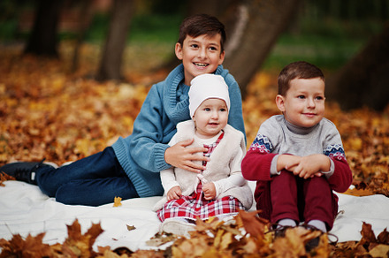 Happy family of three kids at autumn leaves park., a Person Photo by AS photostudio