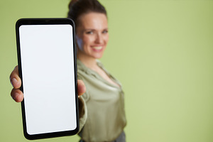 Blurred woman promoting smartphone app, a Business Photo by Alliance Images