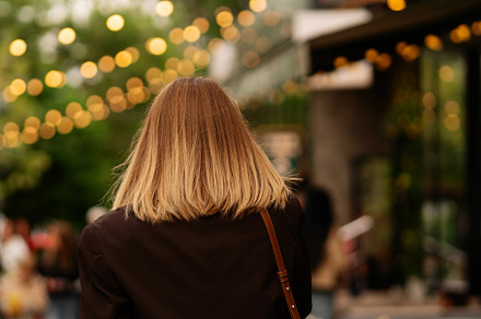 Blonde woman walking outdoors