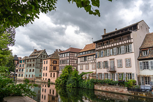 Half timbered houses by the river in Strasbourg, France, an Architecture Photo by GoodGoods