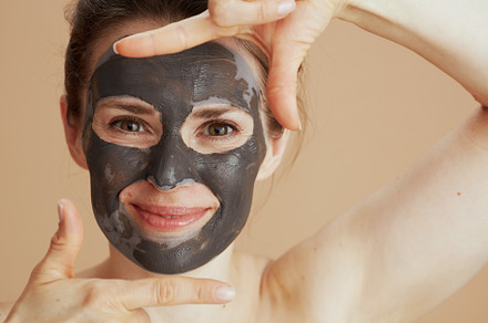 happy modern female with cosmetic mask, a Beauty & Fashion Photo by Alliance Images