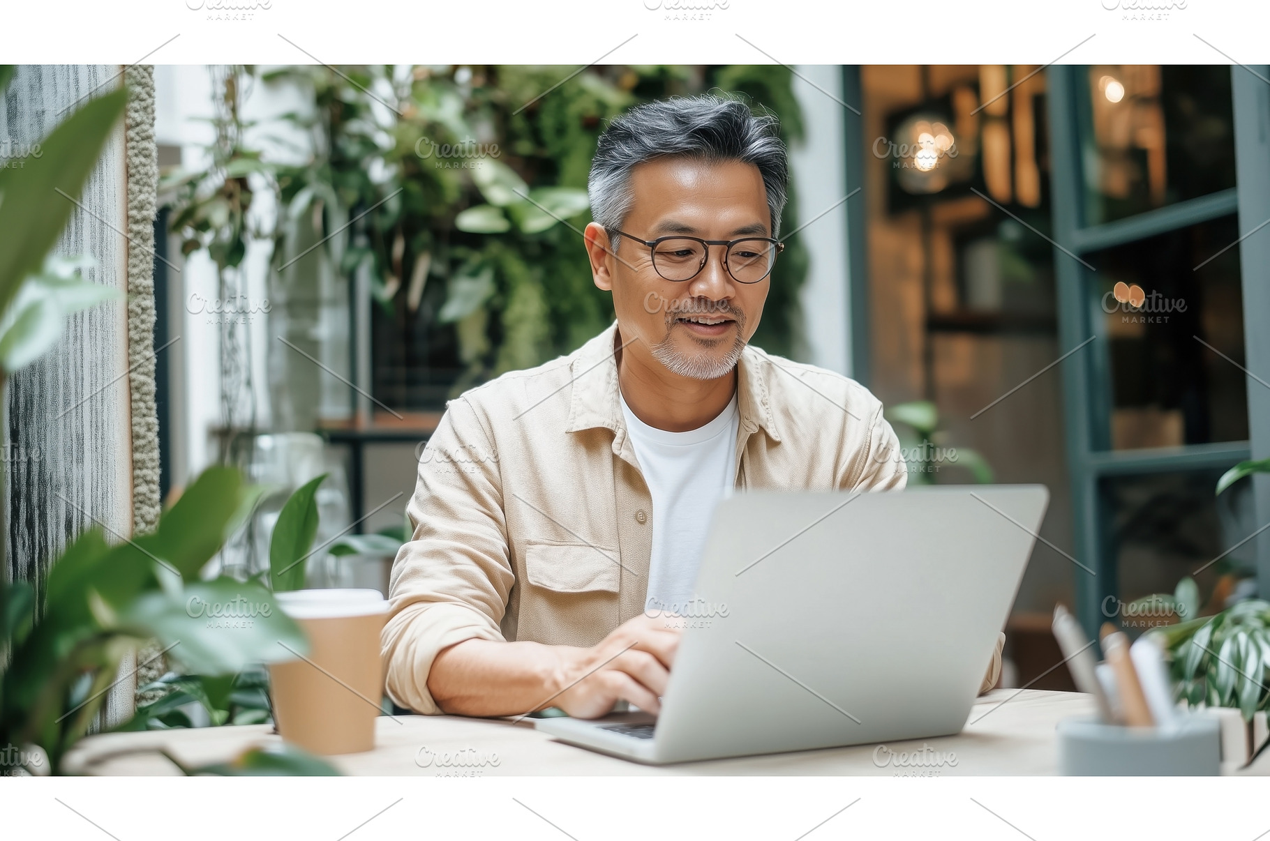 Asian businessman working on a, a Person Photo by Sergey Kotenev