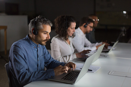 Serious call center operators containing dark, concept, and business