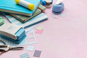 Scrapbooking set creating paper shapes on pink background, an Arts & Entertainment Photo by Olena Rudo