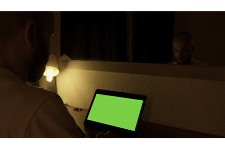 Man sitting at his desk, works on a, a Technology Photo by Media Whale Stock