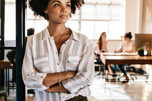 Thoughtful woman at office, a Business Photo by Jacob Lund