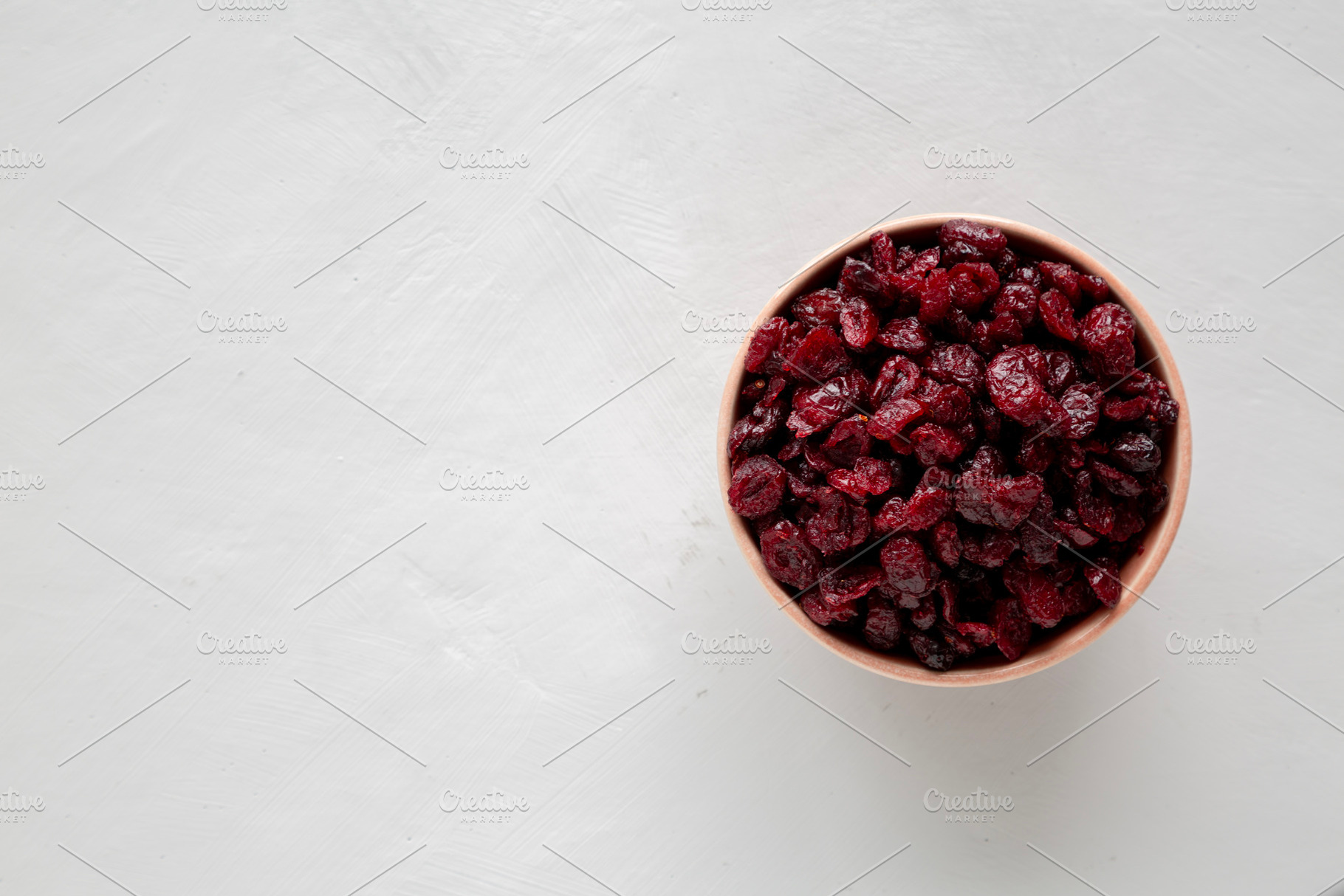 Organic Dried Cranberries in a Bowl, top view. Flat lay, overhea, a Food & Drink Photo by LiudmylaChuhunova