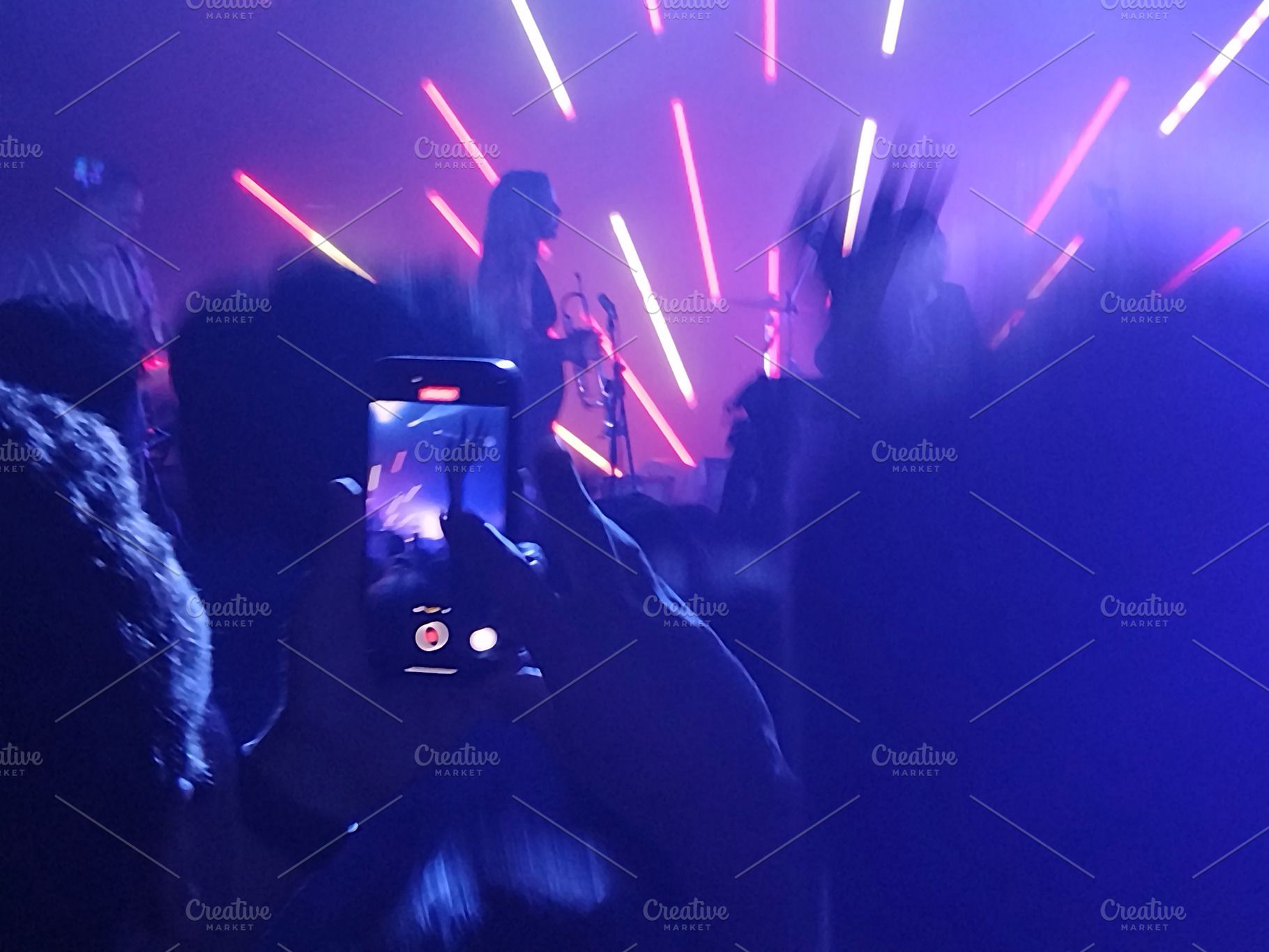 Live band on stage with radial light beams, an Arts & Entertainment Photo by DanFLCreativo