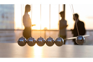 Newton's cradle in the foreground, a Business Photo by Igor Tichonow