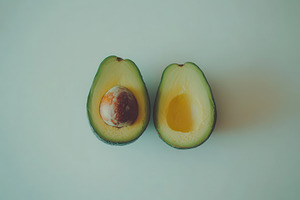 Closeup view of a whole avocado, a Photo by Pavel_design